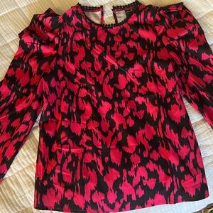 This is a silky shirt made to dress up or dress down. Never worn.